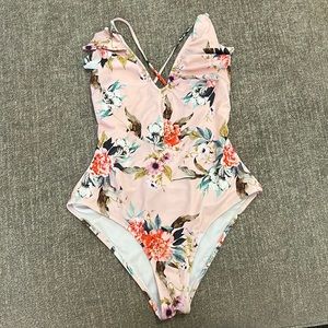 Light pink floral one piece bathing suit.